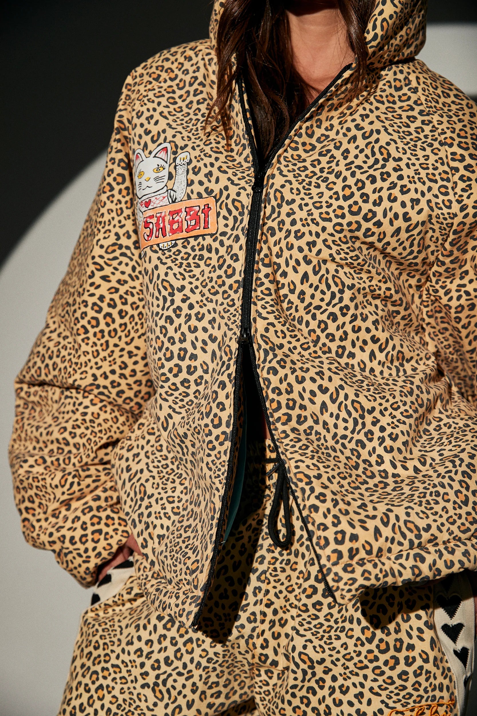 big cat energy puffer modelled half zipped sabbi